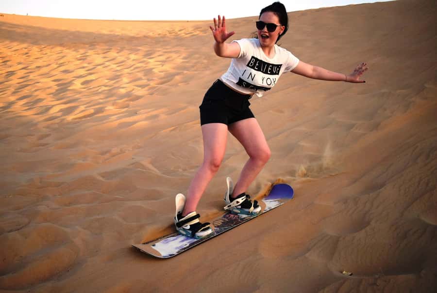Dubai Desert Safari, Quad Biking, Camel Ride, & Sandboarding - Falafel, Barbecue, and a Full Evening Program