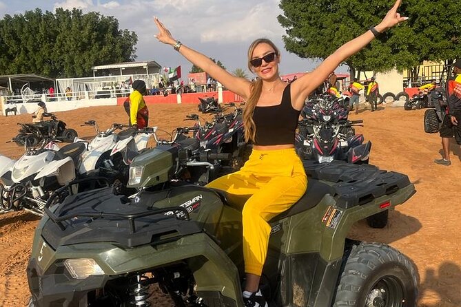 Dubai Desert Safari Sharing with Quad, Shows, Camel and Dinner - Sandboarding and sunset over the desert