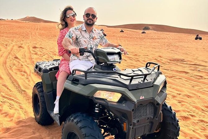 Dubai Desert Safari Sharing with Quad, Shows, Camel and Dinner - Red-dune dune bashing with a licensed guide