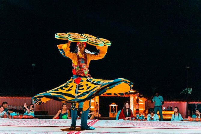 Dubai Desert Safari Tour with Quad Bike for 60mins & BBQ Dinner. - BBQ dinner, tanoura, belly dance, and fire performances