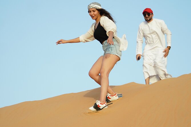 Dubai Desert Safari with 4x4 Cars, Live BBQ, Shows & Much more - Sandboarding and desert photographs