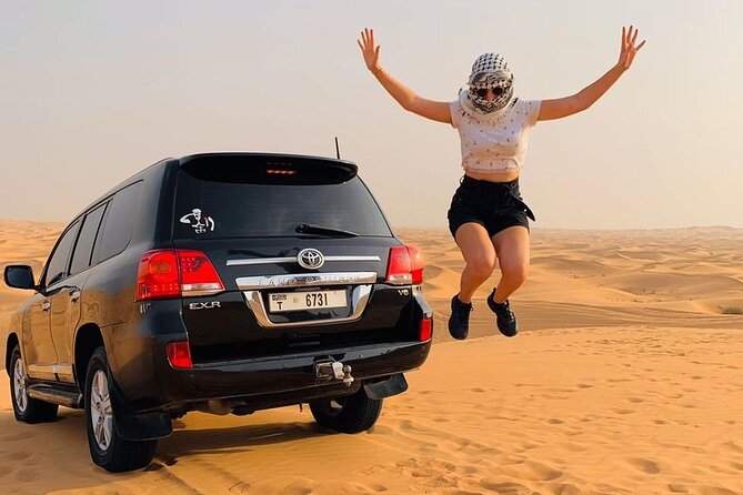 Dubai desert safari with 4x4 Dune Bashing,Camel Ride sand board - A 10 to 15 Minute Stop at Dubai Camel Racing Club