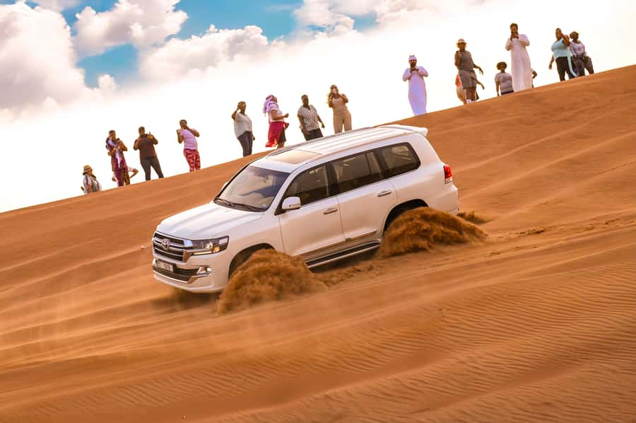 Dubai: Desert Safari with BBQ Dinner & Quad Biking Options - Photo stops and sandboarding on the Lahbab dunes