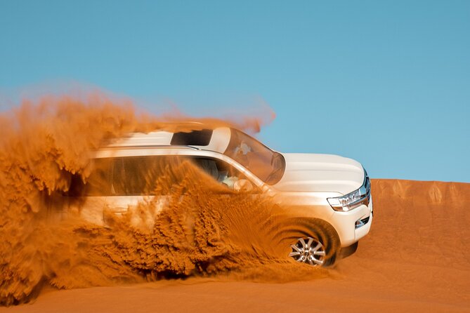 Dubai Desert Safari with Belly Dance, Fire Show and Tanura Show-The Full Package - Camel rides, sandboarding and camp arrival
