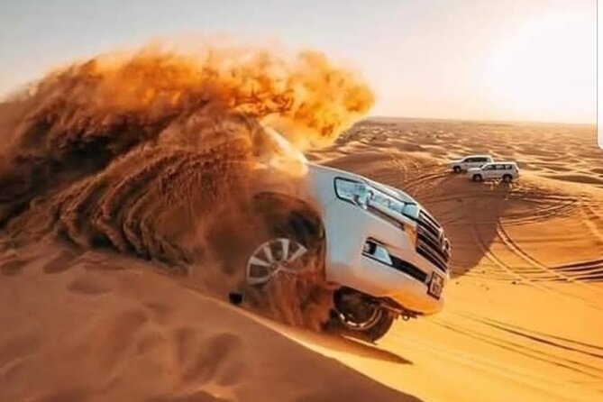 Dubai Desert Safari with Camel Ride, Sand surf, & BBQ Dinner - Crossing the Arabian red dunes