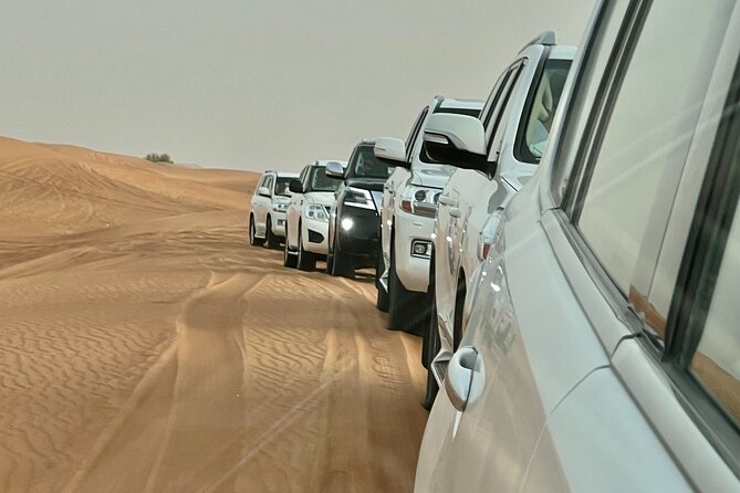 Dubai Desert Safari with Camel Ride, Sand surf, & BBQ Dinner - Live performances after sunset