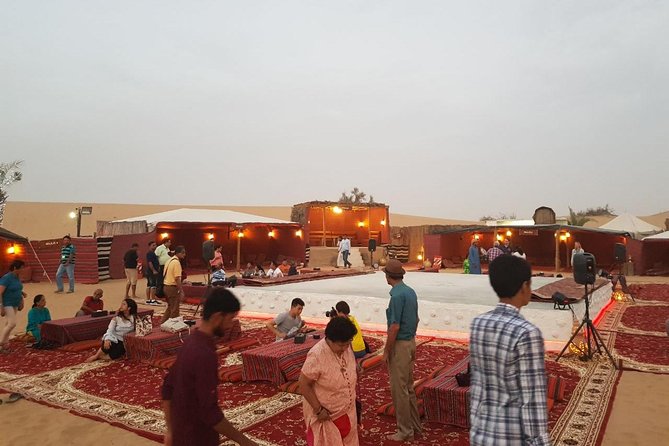 Dubai Desert Safari with Quad Bike, sandboarding, live show & BBQ - Camel riding, henna, and camp traditions