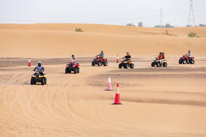 Dubai Desert Safari with Quads, BBQ Dinner, Camel ride, & Shows - Sand art and henna at the camp