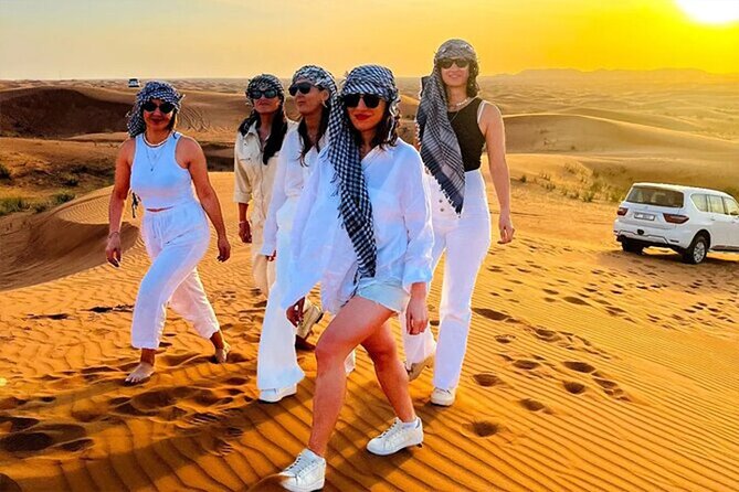 Dubai Desert Safari with Self Drive Quad Biking & Camel Riding - Quad biking across the golden dunes