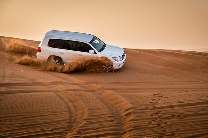 Dubai Desert Safari with Self Drive Quad Biking & Camel Riding - Sandboarding from the high dunes