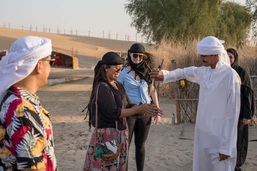 Dubai: Evening Camel Trekking & Dinner at Al Marmoom Oasis - Dinner, stories, and entertainment after dark
