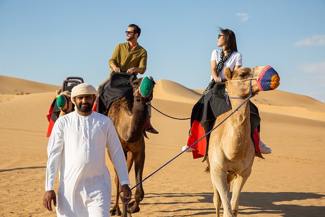 Dubai Evening Desert Safari: Sandboarding, BBQ, Camel Ride & more - Falcon display, henna, and camp atmosphere