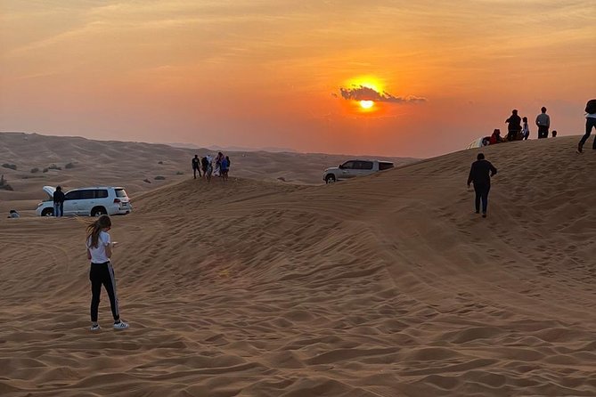 Dubai Evening Desert Safari with ATV Quad Bike & Dinner - Sunset photos and sandboarding from the high dunes
