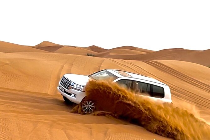 Dubai Evening Desert Safari With Quad Bike and BBQ Dinner - Camel riding and sandboarding add variety