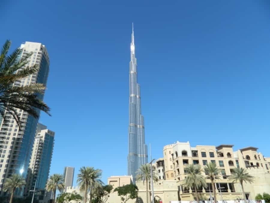 Dubai Full-Day Spanish Language Tour - City of Contrasts - The fabric souk and the abra across Dubai Creek