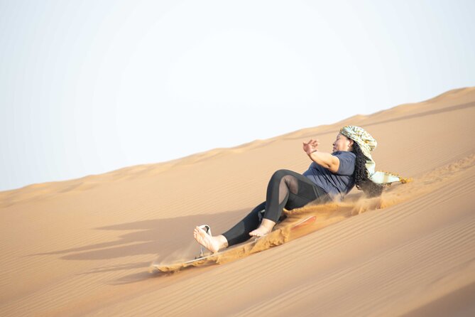 Dubai Half-day Red Dunes bashing with Sandboarding, Camel &Falcon - Falcon photos, Arabic dress, and henna