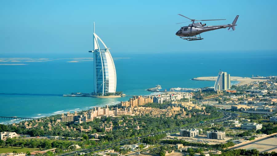 Dubai: Helicopter Ride, Desert Safari, Camels & Refreshments - A short camel ride and falcon encounter