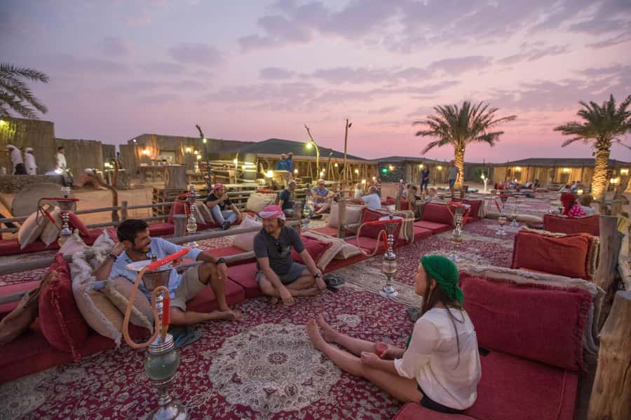 Dubai: Heritage Camel Desert Safari with Traditional Dinner - Entering the traditional camp after dark