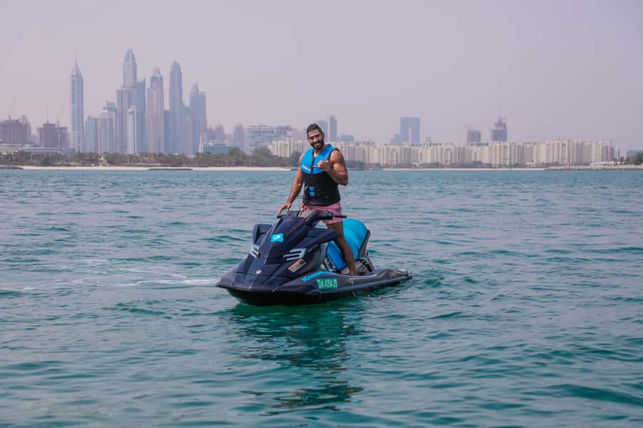 Dubai: Jetski Ride up to 2 People with Photos & Refreshments - Taking the jet ski toward the Burj Khalifa