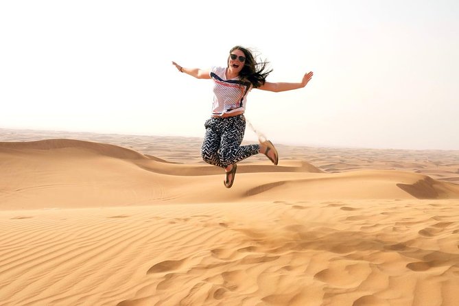 Dubai Morning Safari: Quad Biking, Sandboarding & Camel Ride! - Sandboarding with a simple learning curve