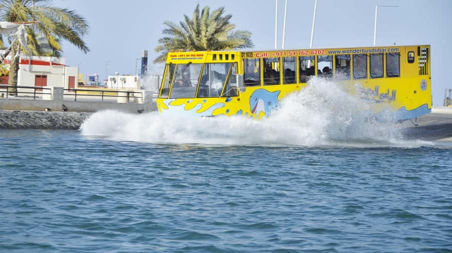 Dubai: Old town tour with Wonder Bus, souks, Creek and Guide - Passing the textile market and heritage districts