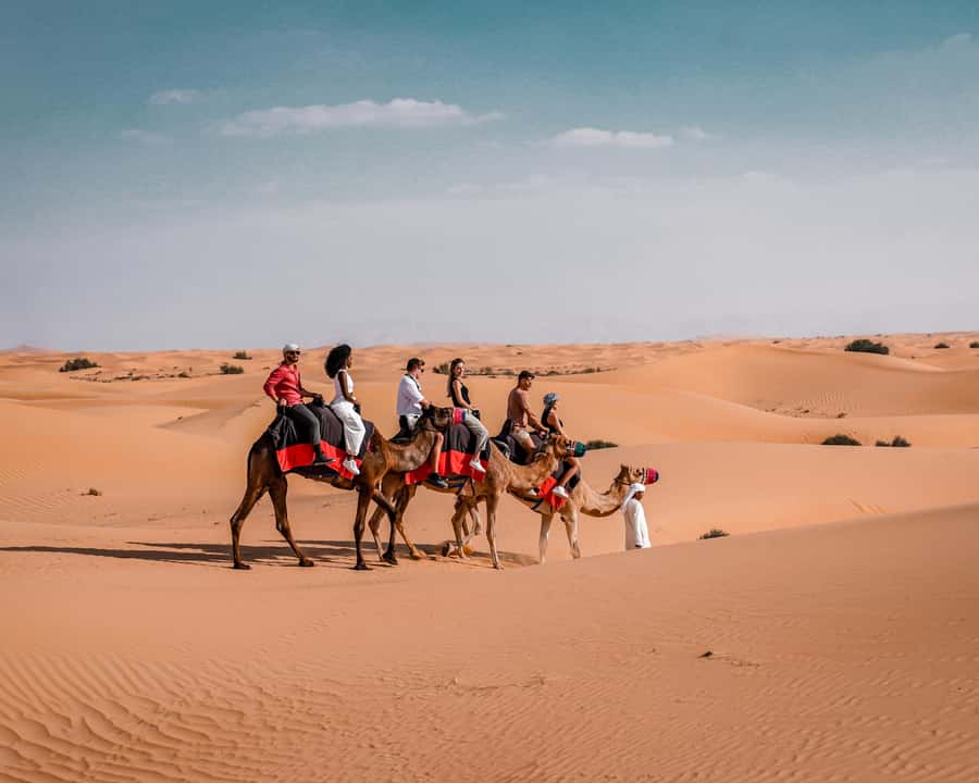 Dubai: Premium Desert Safari, Camel Ride, BBQ & Sandboarding - Camel Ride, Sandboarding, and Henna at the Camp