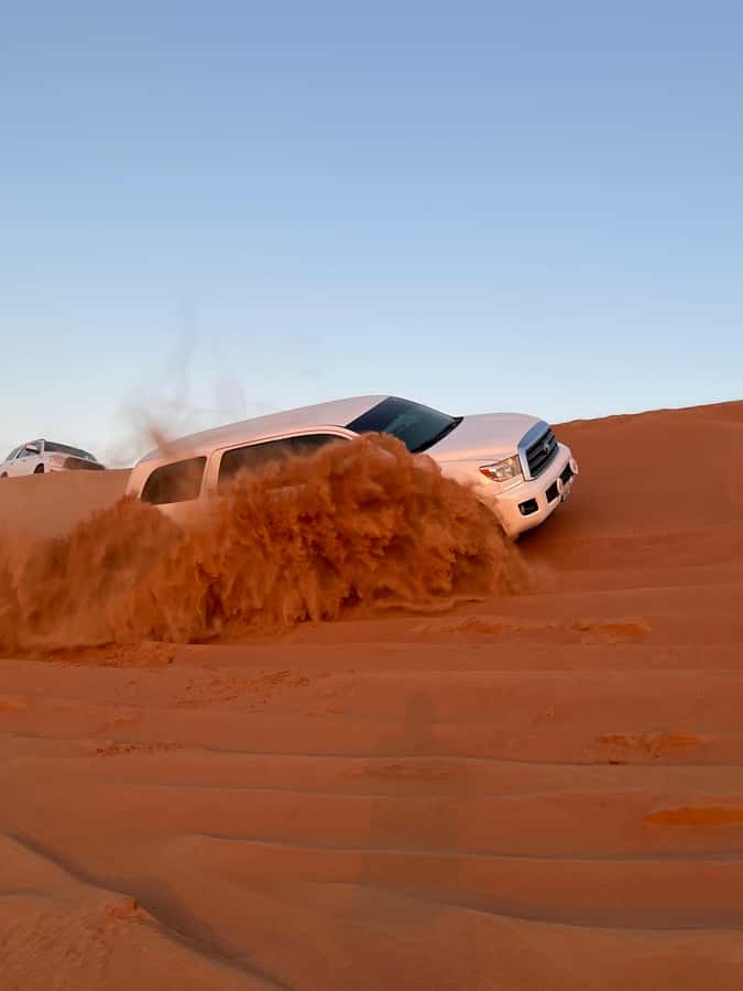 Dubai: Premium Red Dune Safari with Sandboarding & BBQ - From your Dubai hotel to the Lahbab desert