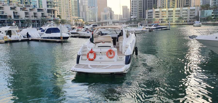 Dubai: Private Boat Cruise from Dubai Marina up to 12 people - Swimming, fishing, music, and food onboard