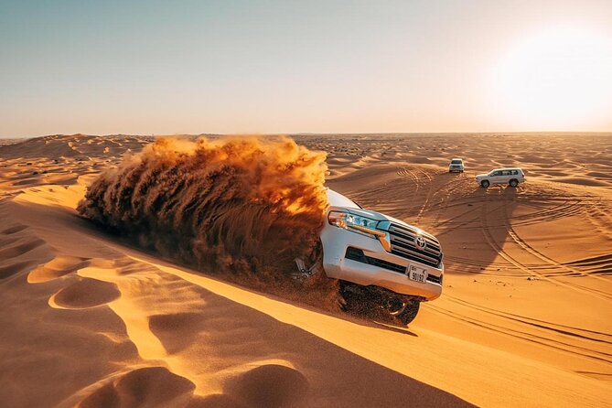Dubai Private Morning Desert Safari: Camel Ride & Sandboarding - Sunrise over Lahbab’s red dunes