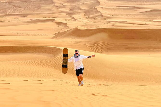 Dubai: Quad Bike Safari, Camels, & Camp with BBQ Dinner - Sandboarding, photographs, and a quick pause