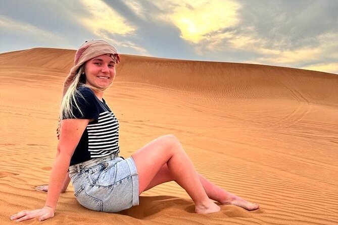 Dubai Red Desert Safari sharing basis with Camel, Shows & Dinner - Camp cushions, Arabic coffee, and henna