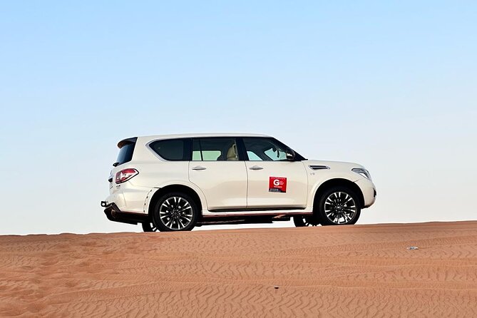 Dubai Red Desert Safari sharing basis with Camel, Shows & Dinner - Sandboarding with a simple learning curve