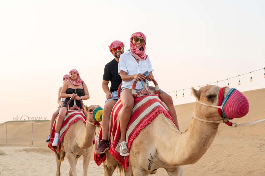 Dubai: Red Dune Desert Safari, Quad Bike, Camels, and BBQ - Sandboarding on the steep red dunes