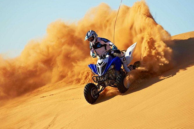 Dubai Red Dune Safari with BBQ Dinner & Live Shows from RAK - Quad bikes, sandboarding, and the first taste of speed