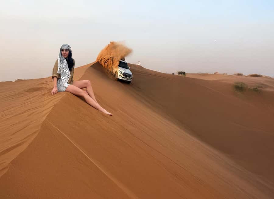 Dubai: Red Dunes Desert Safari with Premium Camp BBQ & Shows - Camel riding, falcon photos, and sandboarding
