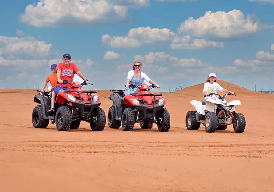 Dubai: Red Dunes Evening Quad Bike, Dune Blast with BBQ - Quad biking across open sand
