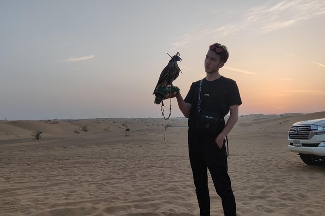 Dubai Red Dunes Quad Bike Tour,Sandboard, Camel ride & BBQ Dinner - A short camel ride, not a long trek
