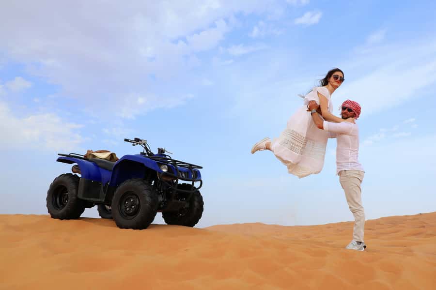 Dubai: Red Dunes Quad Bike with Sandboarding, Camels and BBQ - From Dubai streets to Lahbab’s red dunes