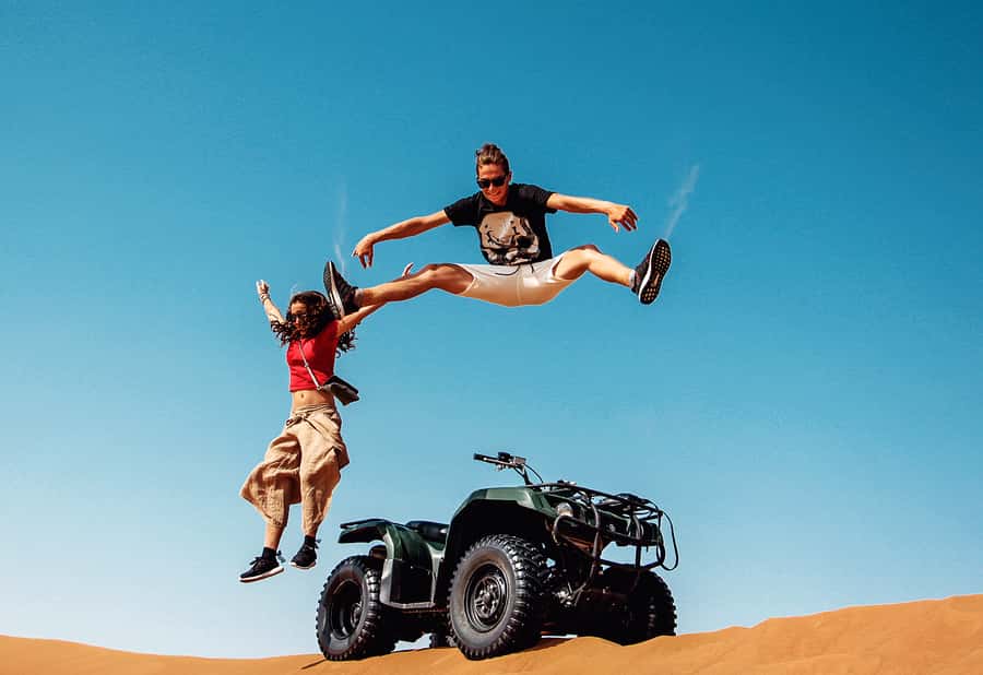 Dubai: Red Dunes Quad Bike with Sandboarding, Camels and BBQ - Sandboarding and desert photographs
