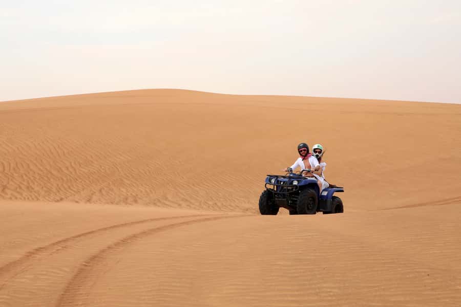 Dubai: Red Dunes Quad Bike with Sandboarding, Camels and BBQ - Best season and best departure time