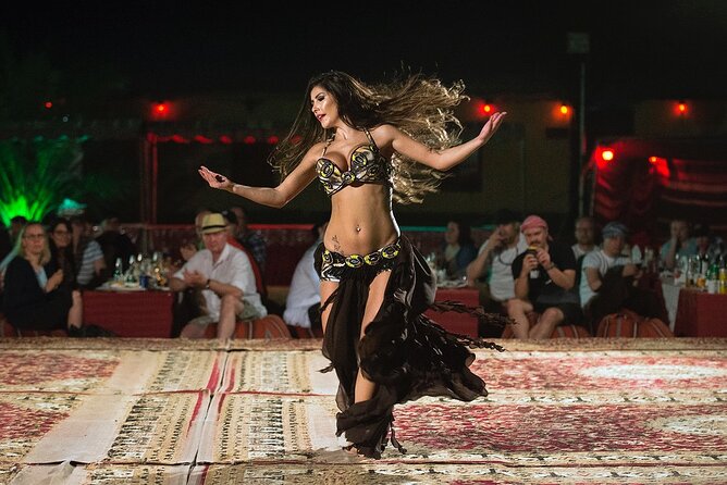 Dubai: Red Dunes, Sandsurf, Camel Ride, BBQ Dinner at Desert Camp - Sunset pictures and traditional dress