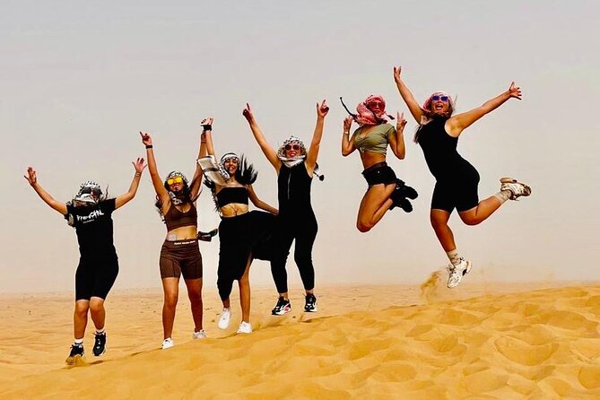 Dubai Red Dunes with Sandboarding, Camel Ride, Falcon & VIP Camp - A short camel ride at twilight