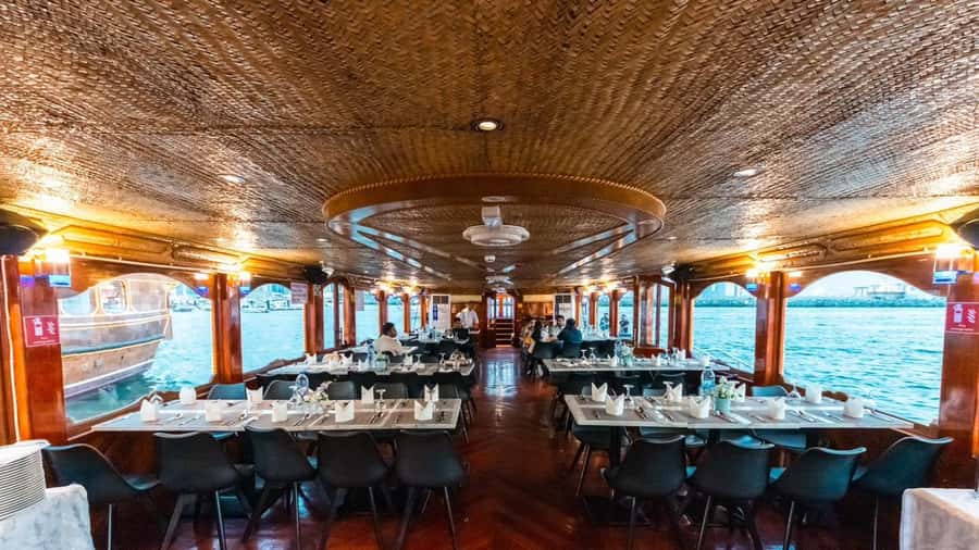 Dubai: Scenic Dhow Cruise with Buffet Dinner and Live Shows - Boarding a traditional dhow for 105 minutes