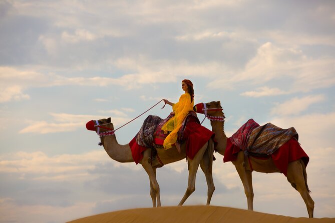Dubai Self-drive Quad Bike, Sand Boarding, Camels & Refreshments - Red dunes, photos, and sandboarding