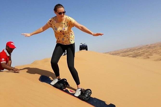 Dubai Self-drive Quad Bike, Sand Boarding, Camels & Refreshments - Getting behind the quad bike