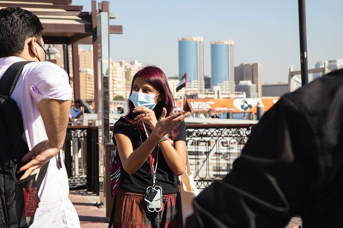 Dubai Souks, Food & Culture Walking Tour - Crossing Dubai Creek on a wooden abra