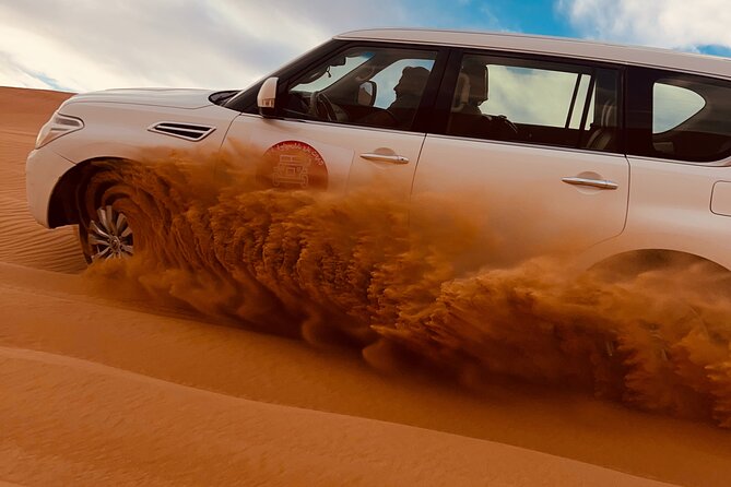 Dubai Sunrise Desert Safari Red Dune Camel Falcon & Sandboarding - The one-hour drive from Dubai to the desert