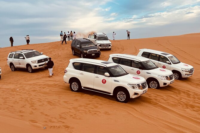 Dubai Sunrise Desert Safari Red Dune Camel Falcon & Sandboarding - Sandboarding on the high dunes