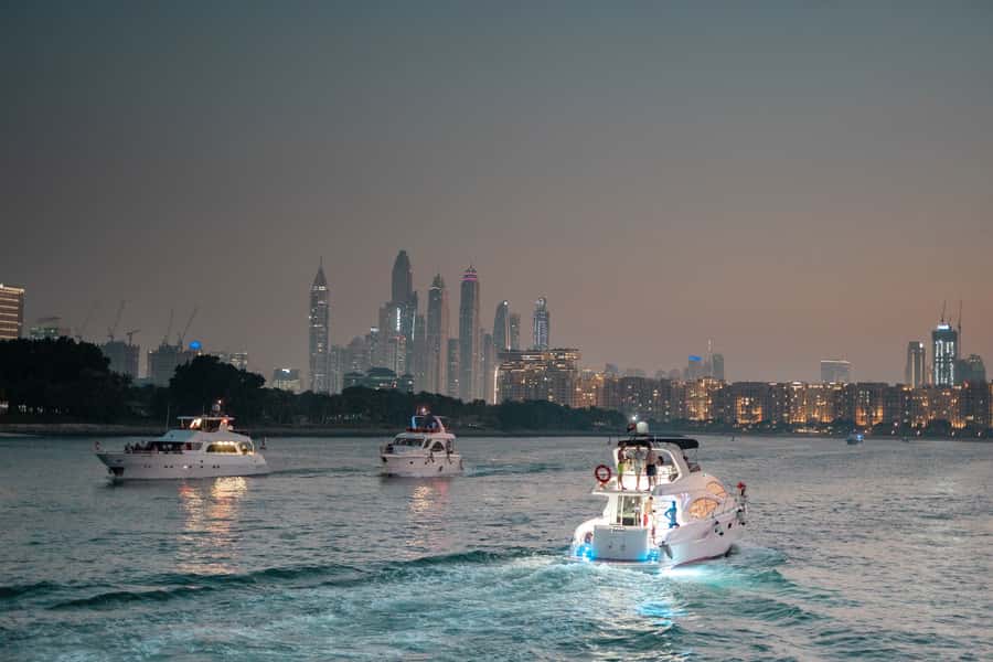 Dubai: Sunset & Night Cruise with Bites and Drinks - Music, crew service, and the mood onboard