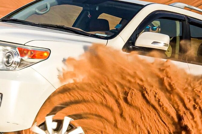 Dubai Unique Sunset Combo: 4WD and Quad Bike Red Dunes Safari - The 30-minute 4WD ride and sandboarding